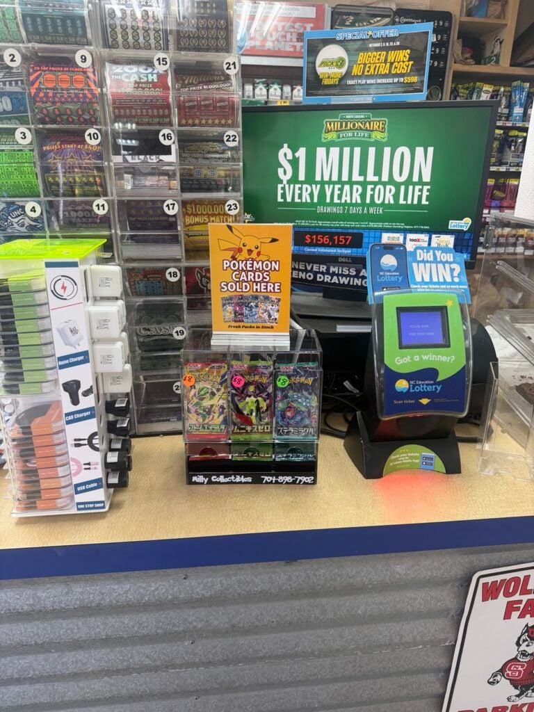 Actual Milly Collectibles Pokémon display beside a checkout ticket scanner